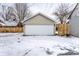 Spacious detached garage with a white door, providing secure parking and storage at 5715 N Delaware St, Indianapolis, IN 46220