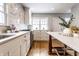 Well-lit kitchen featuring a marble backsplash, stainless steel appliances, and ample storage at 5715 N Delaware St, Indianapolis, IN 46220
