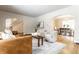 Open-concept living room and dining room with hardwood floors and neutral color palette at 5715 N Delaware St, Indianapolis, IN 46220