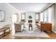 Bright living room with a white brick fireplace, hardwood floors, and comfortable seating at 5715 N Delaware St, Indianapolis, IN 46220
