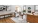 Stylish living room featuring a neutral color scheme, fireplace, and hardwood floors at 5715 N Delaware St, Indianapolis, IN 46220