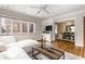 Cozy living room with stylish decor, including a comfortable white sofa and a view to the dining room at 5715 N Delaware St, Indianapolis, IN 46220