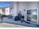 Spacious back patio with sliding glass doors, an outdoor grill, and ample space for entertaining at 6236 White Rabbit Pl, Indianapolis, IN 46235
