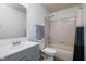 Bathroom with a vanity, mirror, toilet, and combination shower and tub at 6236 White Rabbit Pl, Indianapolis, IN 46235
