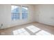 Bedroom with natural light streaming through two windows at 6236 White Rabbit Pl, Indianapolis, IN 46235