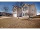 Charming two-story home with a well-manicured front yard and attached two-car garage at 6236 White Rabbit Pl, Indianapolis, IN 46235