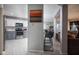 Modern kitchen with stainless steel appliances, grey cabinets, and a breakfast bar at 6236 White Rabbit Pl, Indianapolis, IN 46235