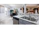Kitchen featuring granite countertops, stainless steel appliances, and an open layout to dining area at 6236 White Rabbit Pl, Indianapolis, IN 46235