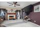 Comfortable living room area with fireplace, flat screen tv, ceiling fan, and lots of space at 6236 White Rabbit Pl, Indianapolis, IN 46235