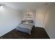 Bedroom featuring a bed, floating shelves, closet door and hardwood floors at 624 Park Dr, Greenwood, IN 46143
