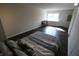 Bedroom featuring a large window and a door, with a bed in the foreground at 624 Park Dr, Greenwood, IN 46143
