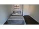 Bedroom with a bed, floating shelves, and a closet door at 624 Park Dr, Greenwood, IN 46143