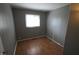 Bright bedroom with hardwood floors and natural light streaming from the window at 624 Park Dr, Greenwood, IN 46143