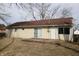 Exterior view of the home featuring a sliding glass door, back door and large window at 624 Park Dr, Greenwood, IN 46143