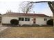 Charming home with manicured lawn, mature shrubbery and front entryway at 624 Park Dr, Greenwood, IN 46143
