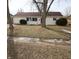 Well-maintained single-story home with tidy front lawn and mature trees at 624 Park Dr, Greenwood, IN 46143