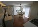 Bright kitchen featuring white appliances, ceiling fan and hardwood floors at 624 Park Dr, Greenwood, IN 46143