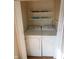 Convenient laundry room with washer, dryer, and shelving for storage at 624 Park Dr, Greenwood, IN 46143