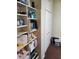 Bedroom closet with open shelving, a bi-fold closet door, and carpeting at 6564 Aintree Pl, Indianapolis, IN 46250