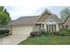 Charming home with a well-manicured lawn, attached garage, and inviting curb appeal at 6564 Aintree Pl, Indianapolis, IN 46250