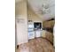 Eat-in kitchen featuring tile floors, cream colored cabinets and vaulted ceiling at 6564 Aintree Pl, Indianapolis, IN 46250