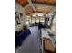 Bright living room with a wooden ceiling, natural light, and neutral carpeting at 6564 Aintree Pl, Indianapolis, IN 46250