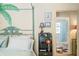 Bedroom with a peek into the ensuite bathroom with a blue shower curtain at 7166 N Oak Ridge Rd, Morgantown, IN 46160