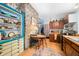 Open kitchen featuring a stone accent wall, wooden cabinets, and a breakfast nook for cozy meals at 7166 N Oak Ridge Rd, Morgantown, IN 46160
