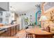 Charming kitchen with wood cabinets, a cozy breakfast table, and ample natural light from the windows at 7166 N Oak Ridge Rd, Morgantown, IN 46160