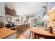 Well-lit kitchen showcasing stainless steel appliances, wooden countertops, and a delightful breakfast area at 7166 N Oak Ridge Rd, Morgantown, IN 46160