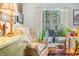 Inviting living area featuring a comfortable chair, bright window, and plant life, creating a relaxing space at 7166 N Oak Ridge Rd, Morgantown, IN 46160