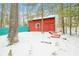 Red outbuilding featuring easy access steps surrounded by a snow covered landscape at 7166 N Oak Ridge Rd, Morgantown, IN 46160