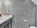 Half-bath featuring striking black and white patterned wallpaper, a sink, and a toilet at 976 Cherry Tree Ln, Greenwood, IN 46143