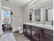 Bathroom featuring double sinks, a vanity and a separate room for the toilet and shower at 976 Cherry Tree Ln, Greenwood, IN 46143