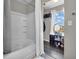 Bathroom features a shower/tub combination and storage shelves for linens and toiletries at 976 Cherry Tree Ln, Greenwood, IN 46143