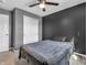This bedroom has neutral colored walls, ceiling fan, and a closet with sliding doors at 976 Cherry Tree Ln, Greenwood, IN 46143