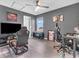 Bright bedroom with a large window, ceiling fan, TV and a gray color scheme at 976 Cherry Tree Ln, Greenwood, IN 46143