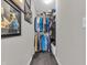 Walk in closet provides ample storage with rods, shelves and some personal memorabilia at 976 Cherry Tree Ln, Greenwood, IN 46143