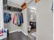 This closet has an access to the bathroom and features a closet with hanging racks and shelves at 976 Cherry Tree Ln, Greenwood, IN 46143