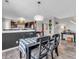 Stylish dining area featuring a modern chandelier, hard wood floors and easy access to the kitchen at 976 Cherry Tree Ln, Greenwood, IN 46143
