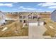 Aerial view of a two-story home with a three-car garage and well-maintained lawn at 976 Cherry Tree Ln, Greenwood, IN 46143