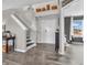 Bright foyer features wood-look floors, white trim, a staircase, and an inviting atmosphere at 976 Cherry Tree Ln, Greenwood, IN 46143