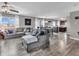 Bright and airy living space with an open floor plan, modern furniture, and seamless flow to the dining area at 976 Cherry Tree Ln, Greenwood, IN 46143