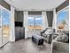 Inviting living room with lots of natural light from the windows and sliding glass doors at 976 Cherry Tree Ln, Greenwood, IN 46143