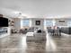 Spacious living room boasts an open layout, sleek flooring, modern furnishings, and abundant natural light at 976 Cherry Tree Ln, Greenwood, IN 46143