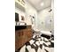 Modern bathroom showcasing geometric tile flooring, patterned glass shower, and a wooden vanity with black hardware at 1046 Nelson Ave, Indianapolis, IN 46203