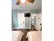 Comfortable bedroom with two beds, wood-look flooring, and white trim, providing a cozy and inviting retreat at 1046 Nelson Ave, Indianapolis, IN 46203