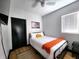 Cozy bedroom featuring a comfortable bed with stylish black metal frame, soft white bedding, and modern decor at 1046 Nelson Ave, Indianapolis, IN 46203