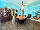 Charming dining room featuring a wooden table with seating, nautical decorations, and wood-look flooring for Gathering meals at 1046 Nelson Ave, Indianapolis, IN 46203
