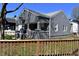 Quaint gray house shows off its clean design and well maintained fence at 1046 Nelson Ave, Indianapolis, IN 46203